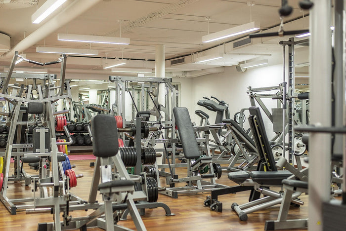 Person training in the gym, balancing weight loss goals with high-protein nutrition