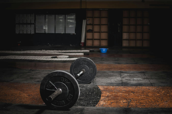 Athlete training in the gym, representing protein quality for muscle recovery